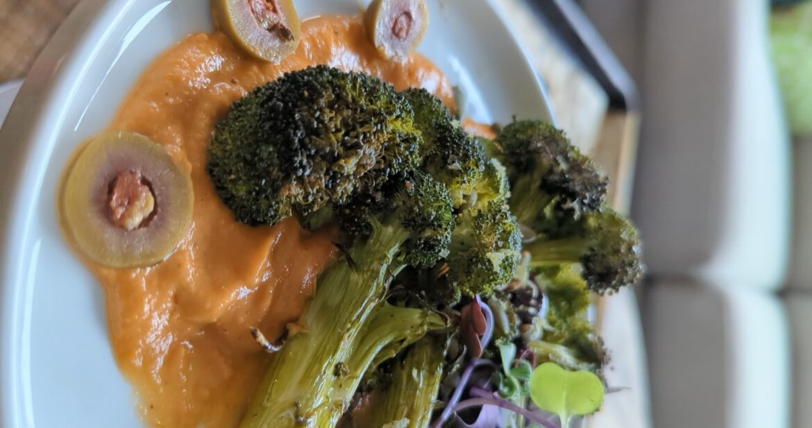 broccoli over buttery tomato sauce