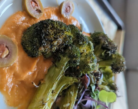 broccoli over buttery tomato sauce